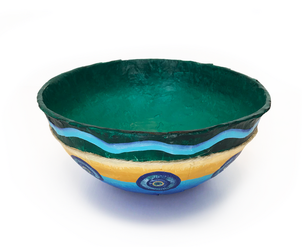 Paper mache coastal bowls bursting with seaside color. Calming qualities of the sea are paired with sandy shore hues. Twine wraps around the diameter as nature’s trim. Handmade with irregular and imperfect surface. Created using recycled and up-cycled materials. Lightweight, durable and vibrant. 9 "to 9 1/2" Diameter - 3 3/4" to 4 1/2" High Sealed inside and out for normal handling and use. For decorative use only - not for food use.  tribegift.com