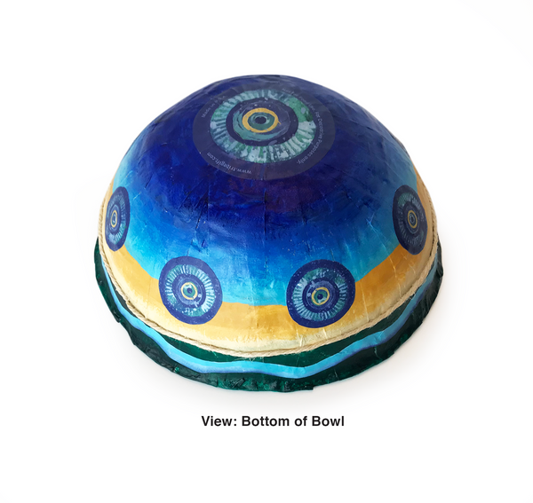 Paper mache coastal bowls have 8 circular prints - 1 ½ inches in diameter - spaced around the sides of the bowl. The same print is placed as a  3 ¼ inch shape on the bottom of the bowl. The circular prints are playfully created using layers of blues, aqua and sandy hues. This bowl is lightweight, durable and vibrant. 9 "to 9 1/2" diameter - 3 3/4" to 4 1/2" high. Sealed inside and out for normal handling and use. For decorative use only - not for food use.  tribegift.com