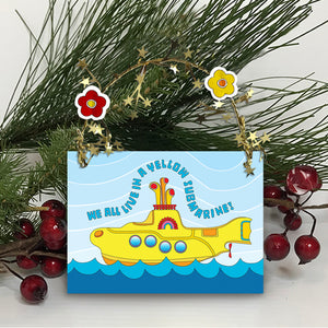 Colorful and sparkling Yellow Submarine Christmas ornament for you or your special someone! A Yellow Submarine sails the sea amid golden garland reflections. Unique one-of-a-kind ornament. Two flower heads accent a golden star-wired garland hoop affixed to the top and works perfect for hanging! Quantity pricing - 1 for 8.95, 4 for 6.74 each, and 8+ for 4.87 each. Great way to say "Merry Christmas" or "Happy Holidays" in Beatle language! tribegift.com