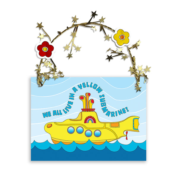 Colorful and sparkling Yellow Submarine Christmas ornament for you or your special someone! A Yellow Submarine sails the sea amid golden garland reflections. Unique one-of-a-kind ornament. Two flower heads accent a golden star-wired garland hoop affixed to the top and works perfect for hanging! Quantity pricing - 1 for 8.95, 4 for 6.74 each, and 8+ for 4.87 each. Great way to say "Merry Christmas" or "Happy Holidays" in Beatle language! tribegift.com